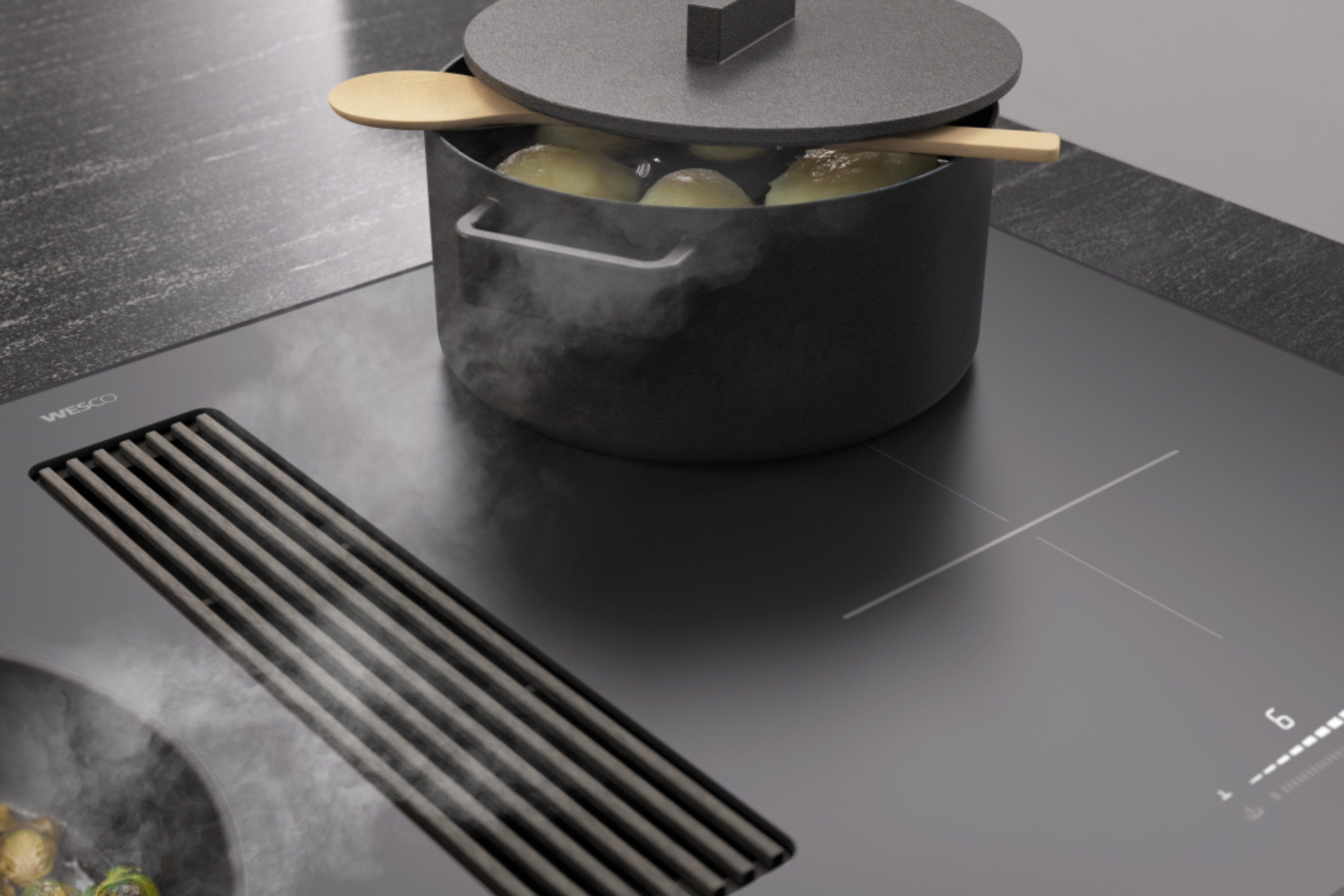 Table de cuisson noir mat avec casserole